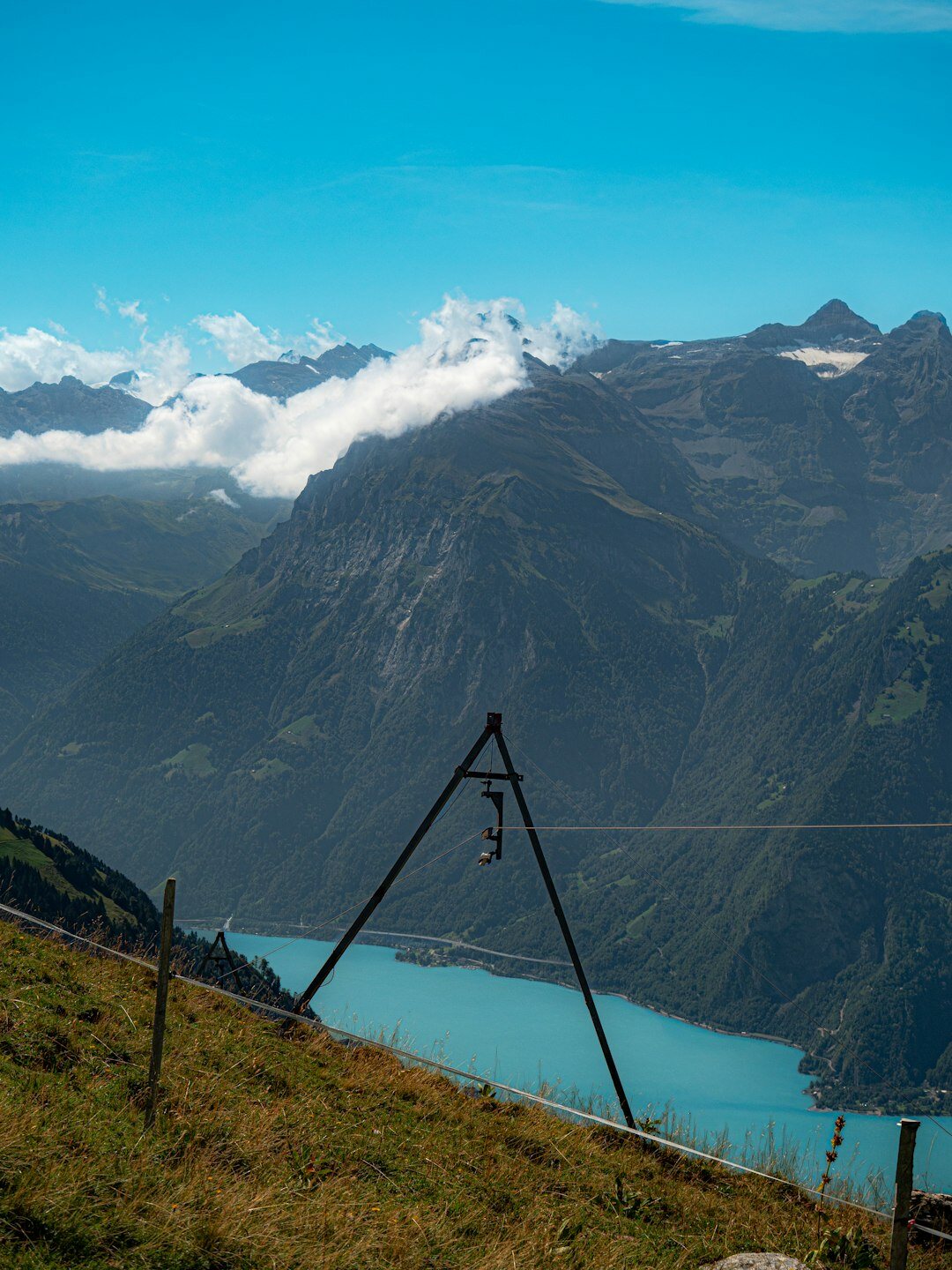 Camera on a tripod overlooking a Swiss alpine lake at sunrise