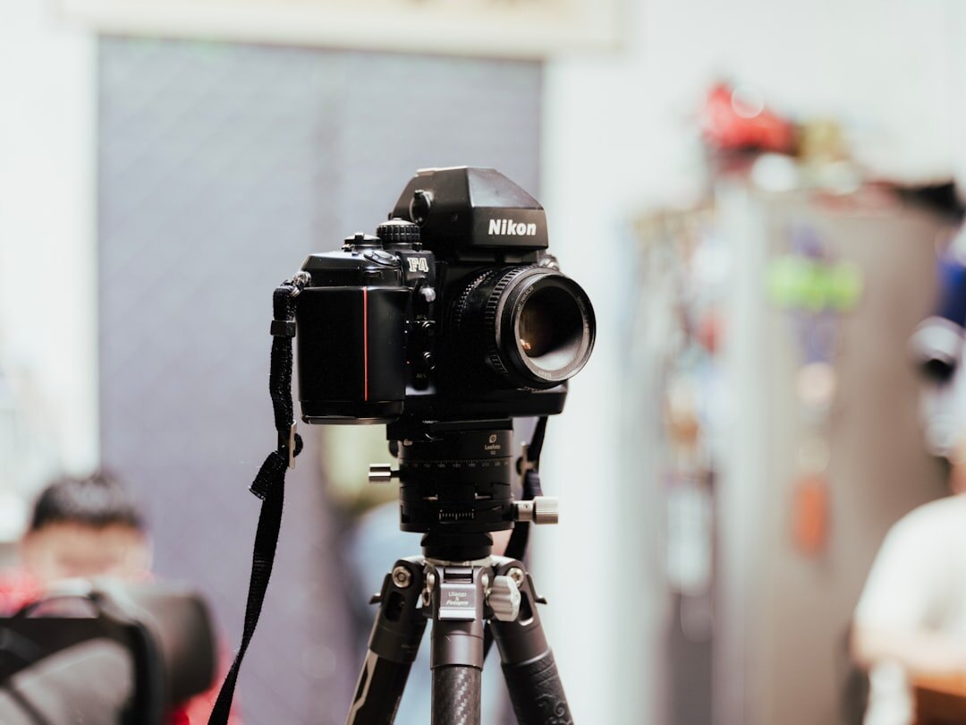 Professional cinema camera mounted on a tripod in a studio
